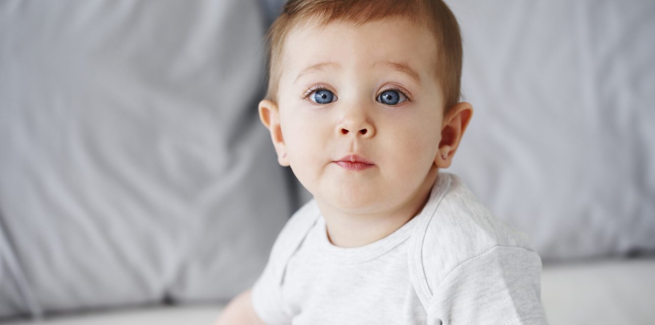 Shot of cute baby girl looking at camera